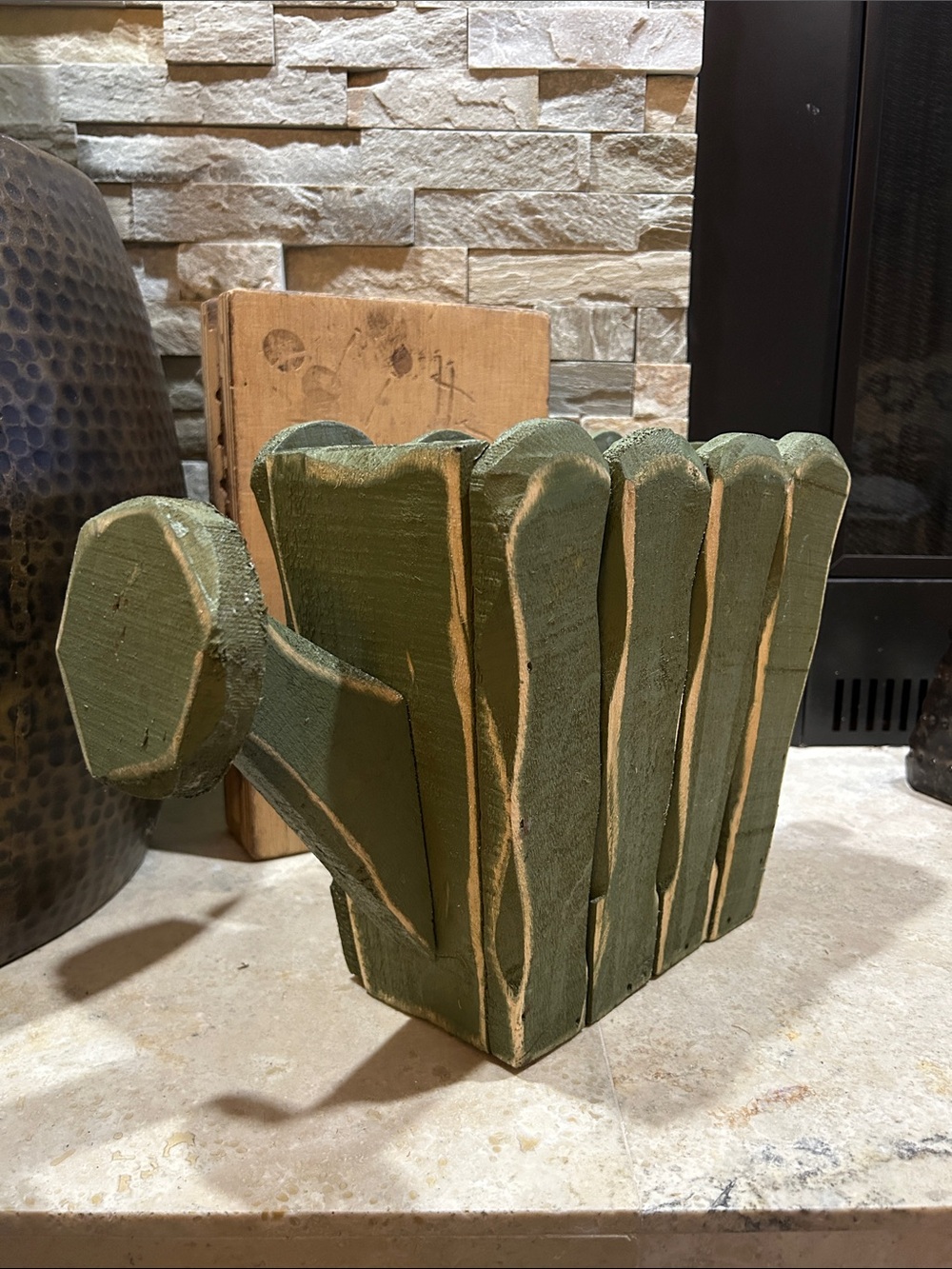 Vintage decorative green wooden planter shaped like a watering can